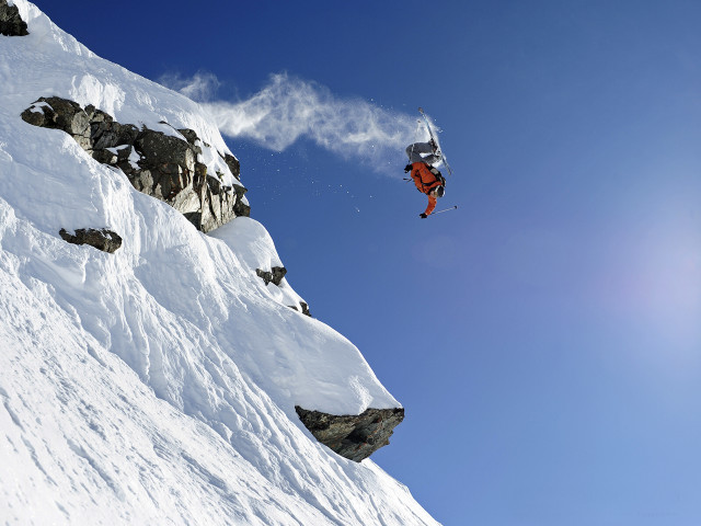 Snowboard jump mountain rocks blue free wallpaper - medium preview image
