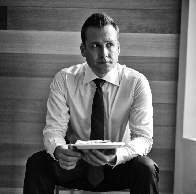 Man tie sitting holding plate free wallpaper - medium preview image