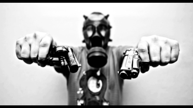 Man gas mask holding guns free wallpaper - medium preview image