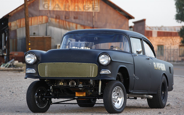 Black car parked building garage free wallpaper - medium preview image