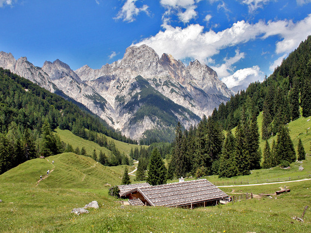 Small cabin grassy field mountains free wallpaper - medium preview image