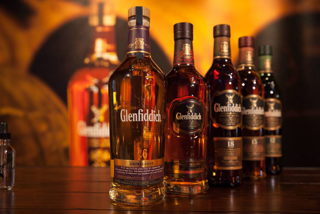 Liquor bottles camera table wall free wallpaper - medium preview image