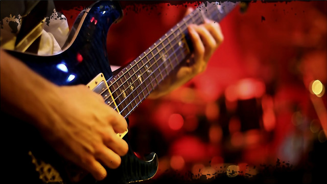 Guitarist blurry lights red background free wallpaper - medium preview image