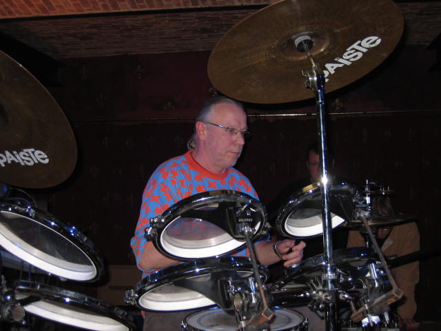 Man playing drums brick wall free wallpaper - medium preview image