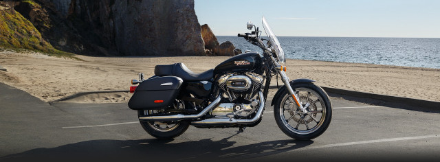 Motorcycle parked ocean cliff beach free wallpaper - medium preview image