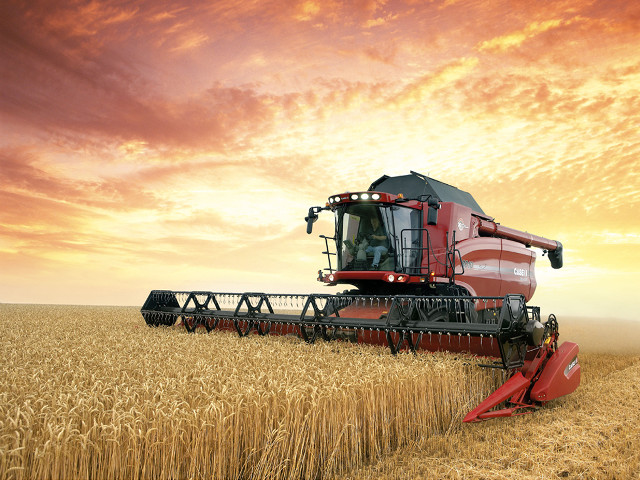 Red combine harvesting wheat cloudy #2 free wallpaper - medium preview image