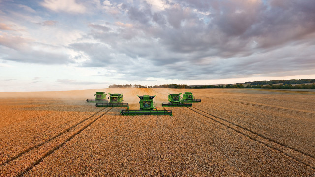 Large field green tractors cloudy free wallpaper - medium preview image