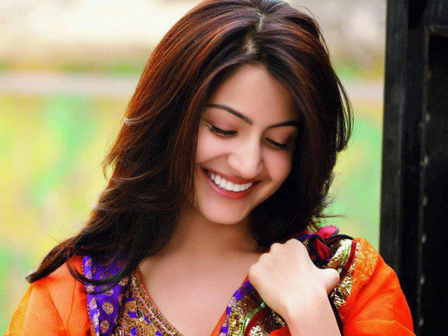 Woman smiling wristwatch colorful blouse free wallpaper - medium preview image