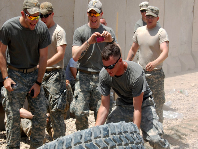 Military men working tire dirt free wallpaper - medium preview image