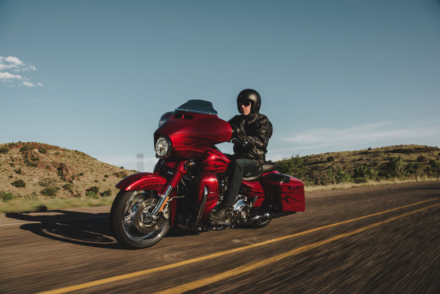Man riding red motorcycle green free wallpaper - medium preview image