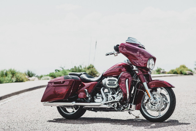 Red motorcycle parked road grass free wallpaper - medium preview image