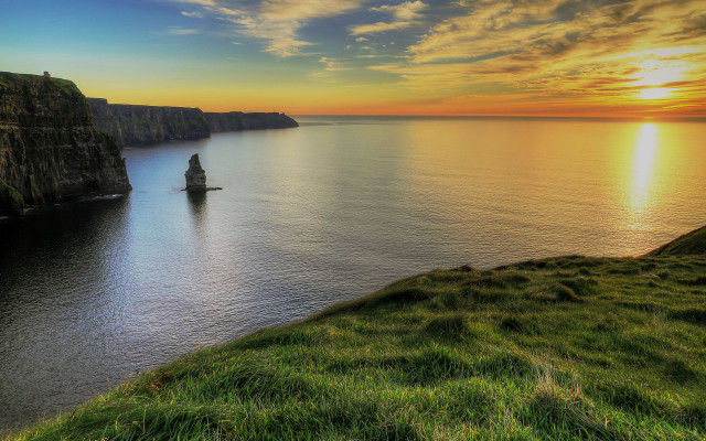 Boat sunset cliff grass lake free wallpaper - medium preview image
