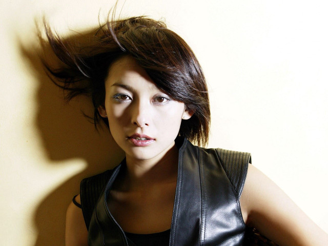 Woman black leather vest hair free wallpaper - medium preview image
