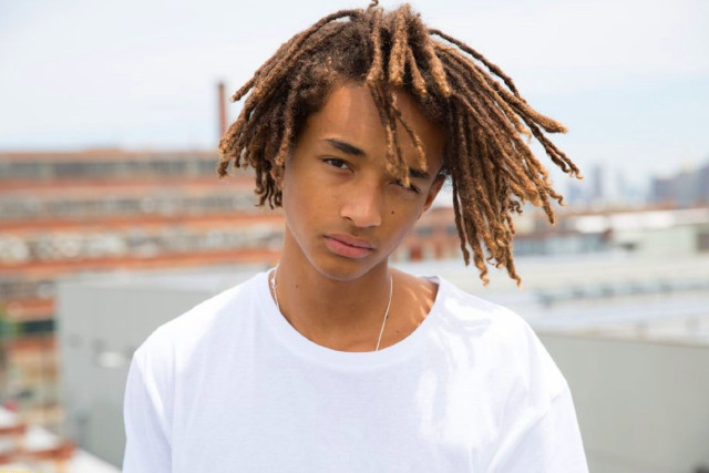 Young man dreadlocks rooftop city free wallpaper - medium preview image