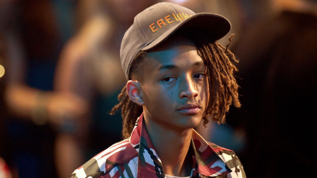 Young man dreadlocks hat serious free wallpaper - medium preview image