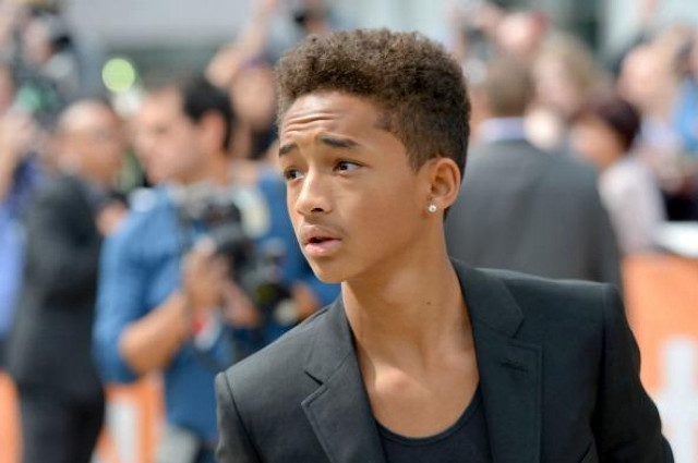 Young man suit camera crowd free wallpaper - medium preview image