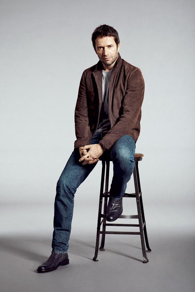 Man sitting stool legs crossed free wallpaper - medium preview image