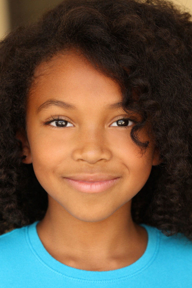 Young girl blue shirt brown free wallpaper - medium preview image