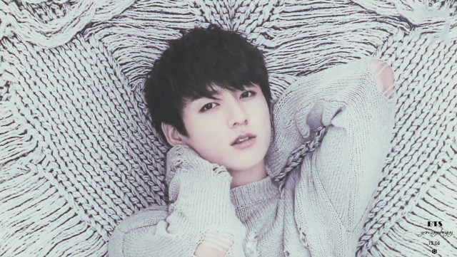 Person laying bed sweater hand free wallpaper - medium preview image