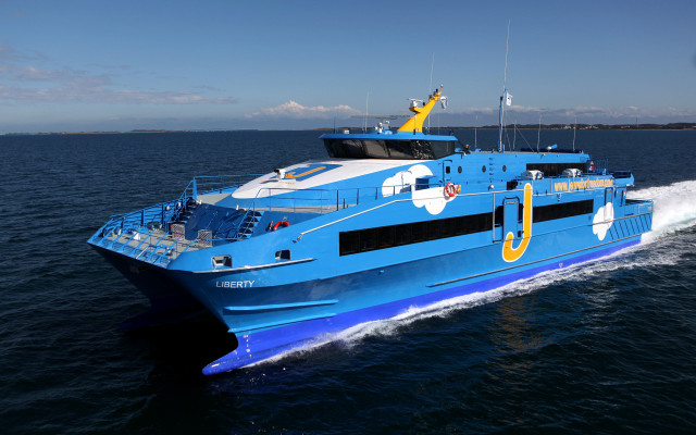 Blue white boat traveling water free wallpaper - medium preview image