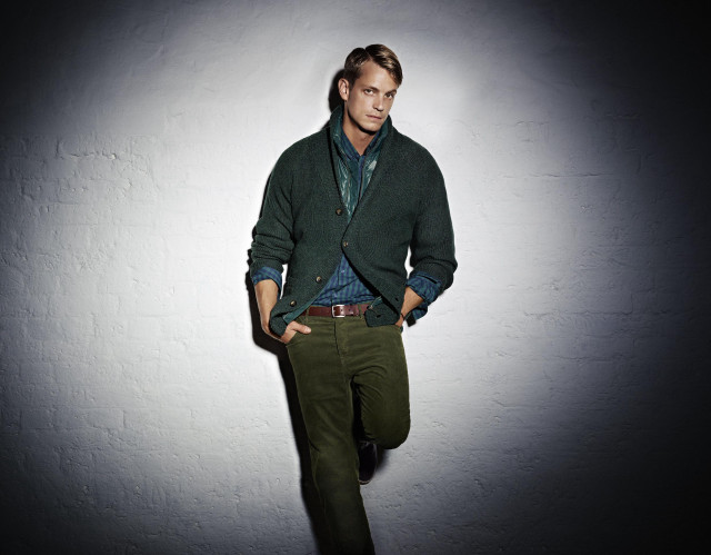 Man green sweater dark room free wallpaper - medium preview image