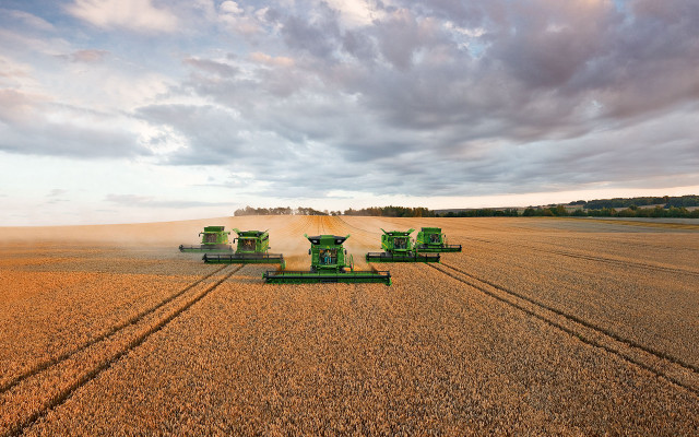 Green farm equipment wheat field free wallpaper - medium preview image