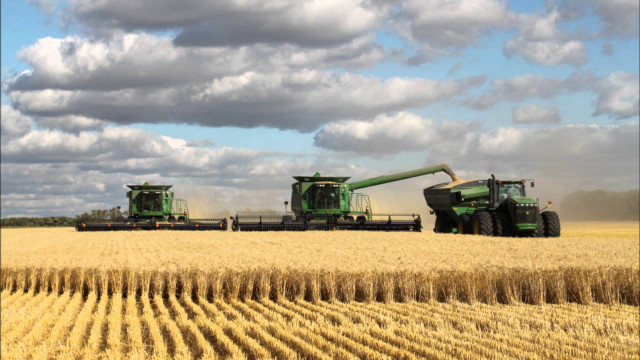 Green tractors wheat field clouds free wallpaper - medium preview image