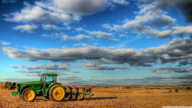 Tractor field cloudy sky people free wallpaper - medium preview image