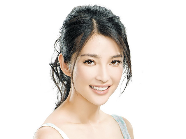 Woman ponytail smiling camera white free wallpaper - medium preview image