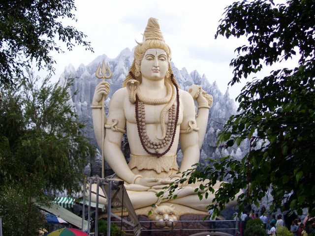 Statue person sitting mountain range free wallpaper - medium preview image
