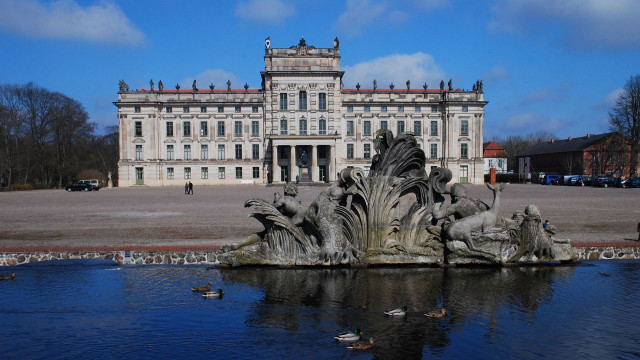 Large building fountain ducks swimming free wallpaper - medium preview image