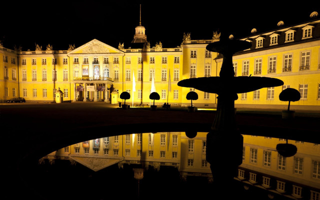 Large building fountain night reflection free wallpaper - medium preview image