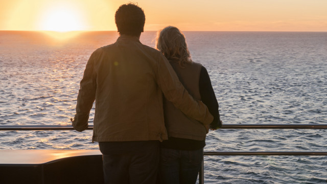 Man woman boat ocean sunset free wallpaper - medium preview image
