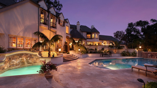 Large house pool patio nighttime free wallpaper - medium preview image