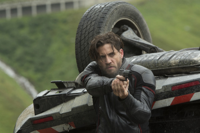 Man holding gun truck tire free wallpaper - medium preview image