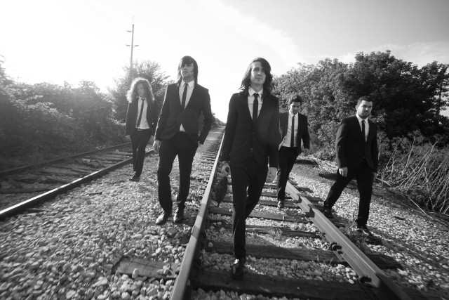 Men suits walking train tracks free wallpaper - medium preview image