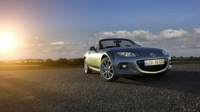 Car parked sun clouds sky free wallpaper - medium preview image