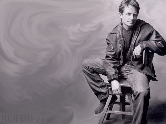 Man sitting stool suit tie free wallpaper - medium preview image
