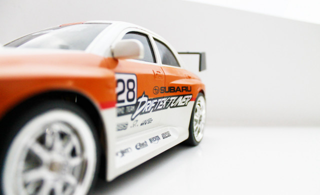 Toy car white surface background free wallpaper - medium preview image