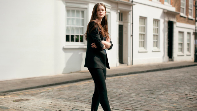 Woman suit brick street white free wallpaper - medium preview image