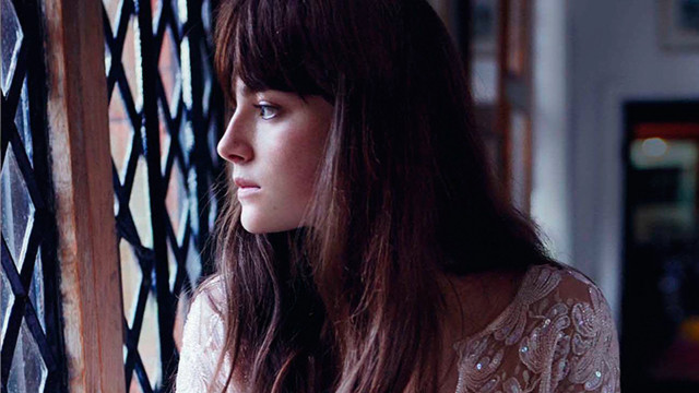 Woman looking out window serious free wallpaper - medium preview image