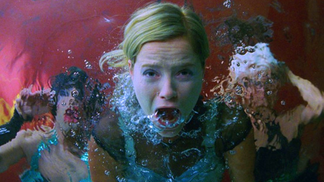 Woman submerged water hands mouth free wallpaper - medium preview image