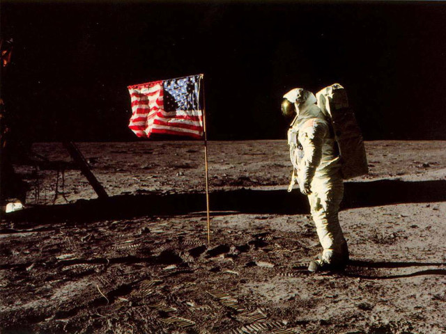 Astronaut standing on moon next free wallpaper - medium preview image