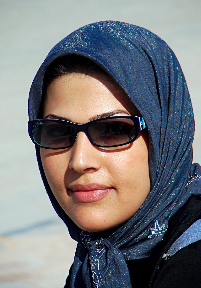 Woman blue scarf sunglasses serious free wallpaper - medium preview image