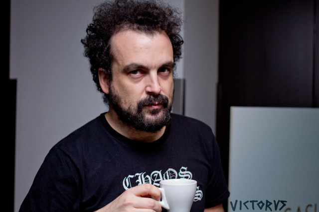Man holding coffee serious look free wallpaper - medium preview image
