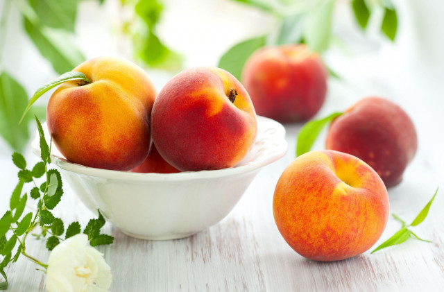 Bowl of peaches white table free wallpaper - medium preview image