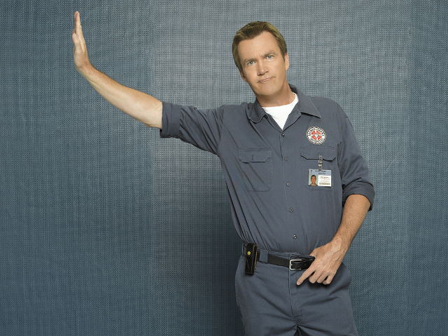 Man blue uniform pointing wall free wallpaper - medium preview image
