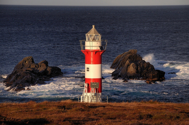 Lighthouse rocky shore ocean waves free wallpaper - medium preview image