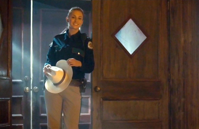 Woman police uniform doorway hat free wallpaper - medium preview image