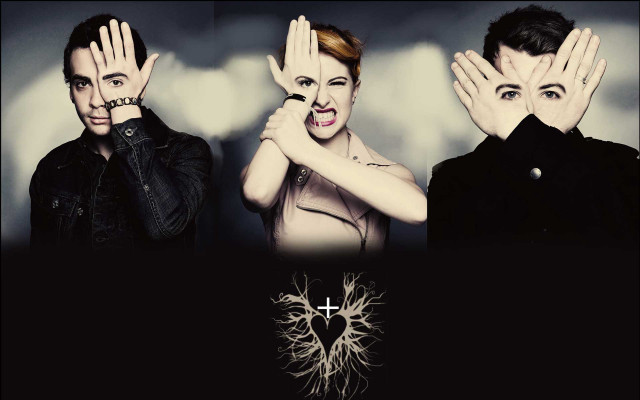 Couple covering faces hands cross free wallpaper - medium preview image